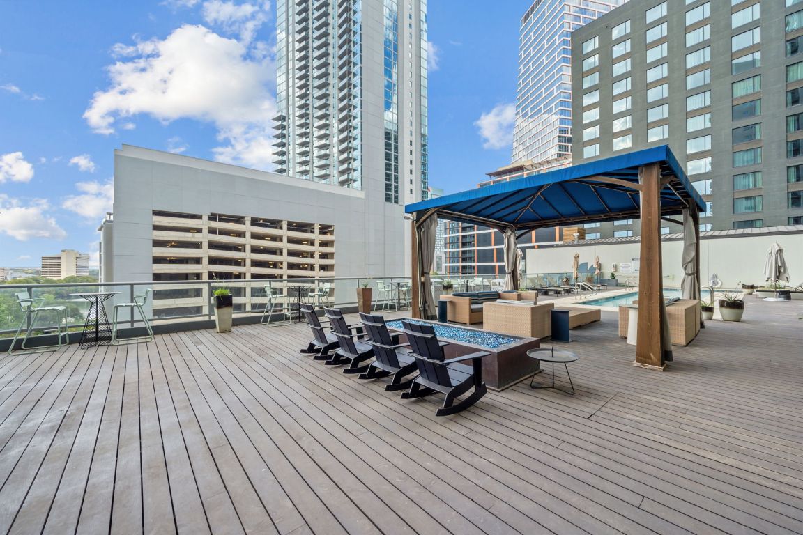 603 Davis Street, Unit 710 Austin, TX 78701 - Photo 24 of 37 a view of a roof deck with table and chairs