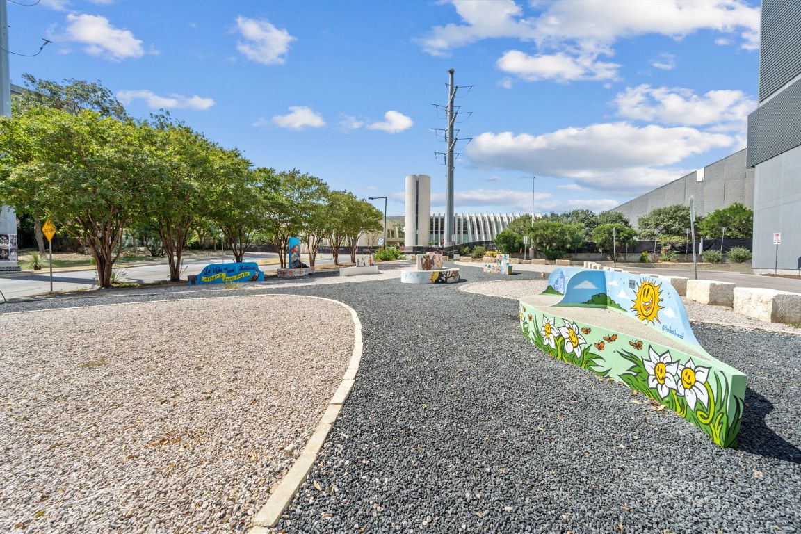603 Davis Street, Unit 710 Austin, TX 78701 - Photo 30 of 37 a childrens park with lots of swings slides and swimming pool