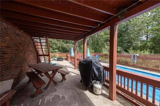 a view of a patio with a table and chairs