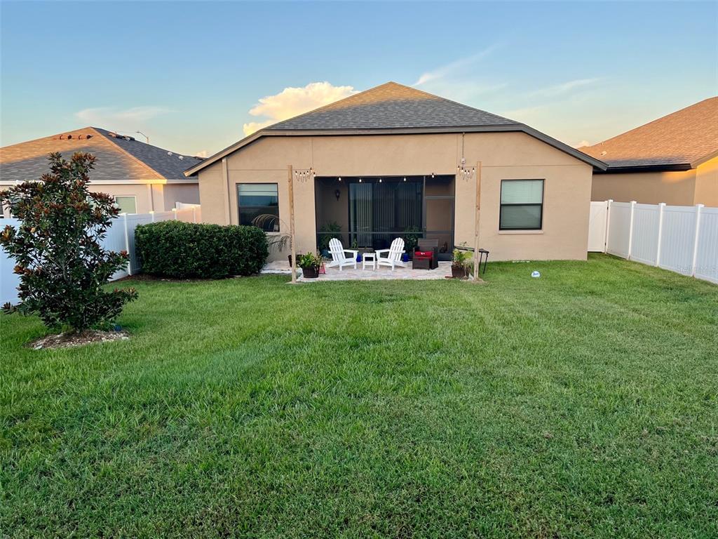 868 Old Windsor Way Spring Hill, FL 34609 - Photo 14 of 20 a front view of a house with a yard and porch