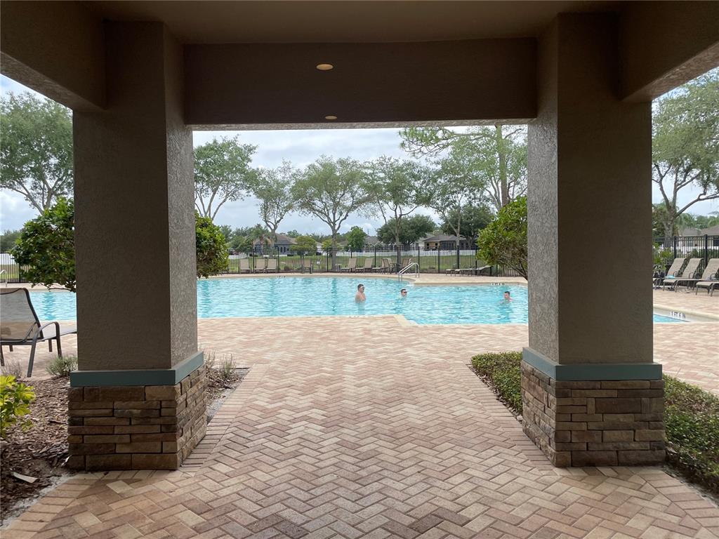 868 Old Windsor Way Spring Hill, FL 34609 - Photo 19 of 20 a view of a yard with a porch