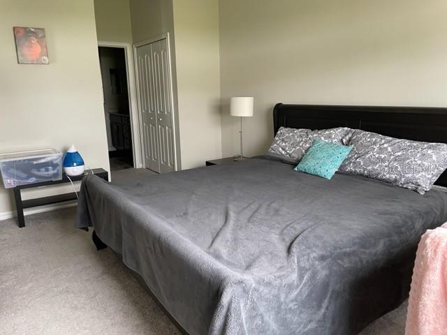 868 Old Windsor Way Spring Hill, FL 34609 - Photo 8 of 20 a bedroom with a bed and a chair