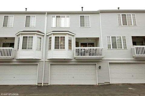 a front view of a house with stairs