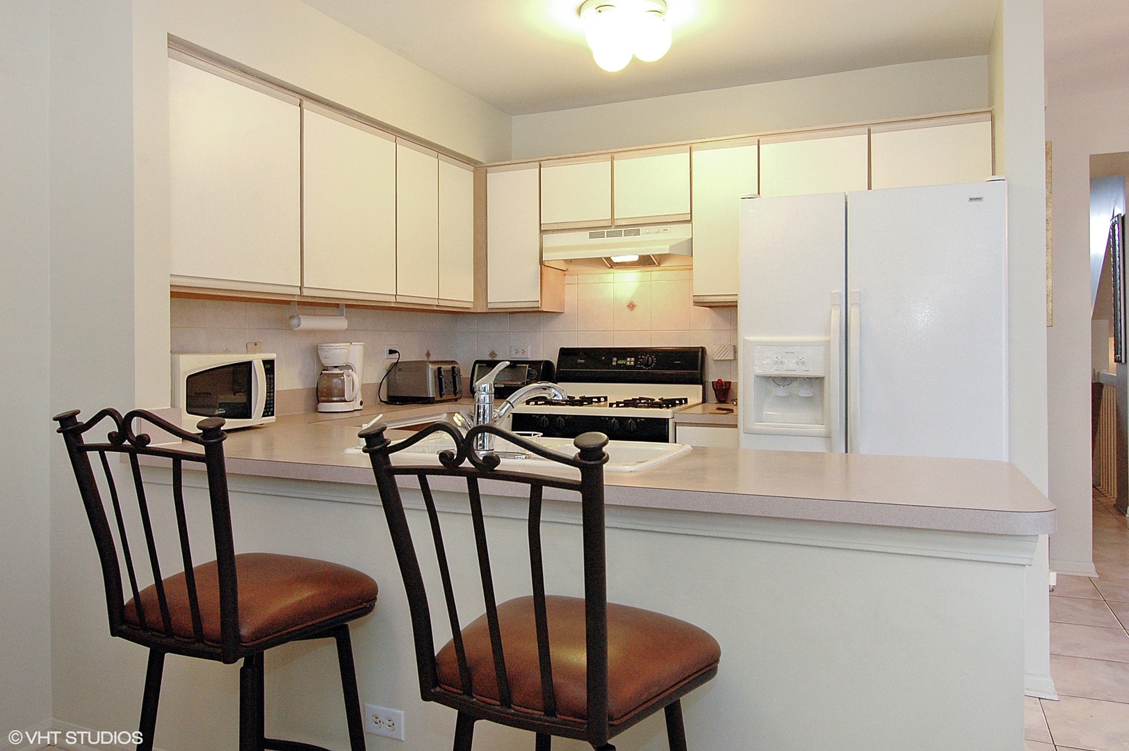 2237 Dawson Lane, Unit 2237 Algonquin, IL 60102 - Photo 4 of 14 a kitchen with stainless steel appliances a refrigerator and a stove top oven