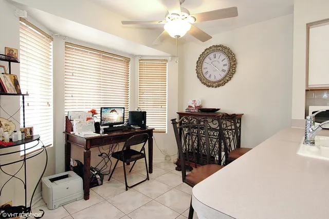 a view of a workspace with furniture