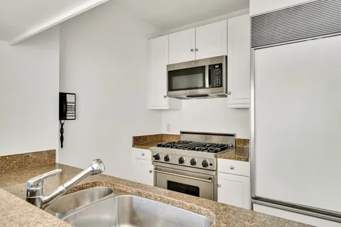 a kitchen with a stove and a microwave