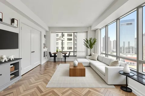 a living room with furniture large window and flat screen tv