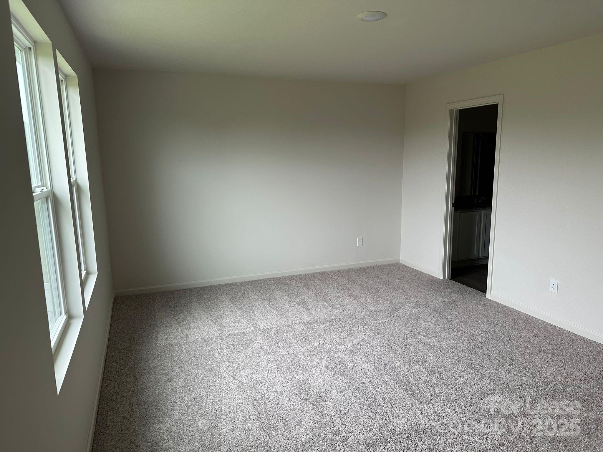 1934 Tranquility Circle, Unit A Newton, NC 28658 - Photo 5 of 10 an empty room with windows