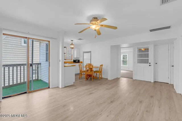 a view of a livingroom with furniture and a window