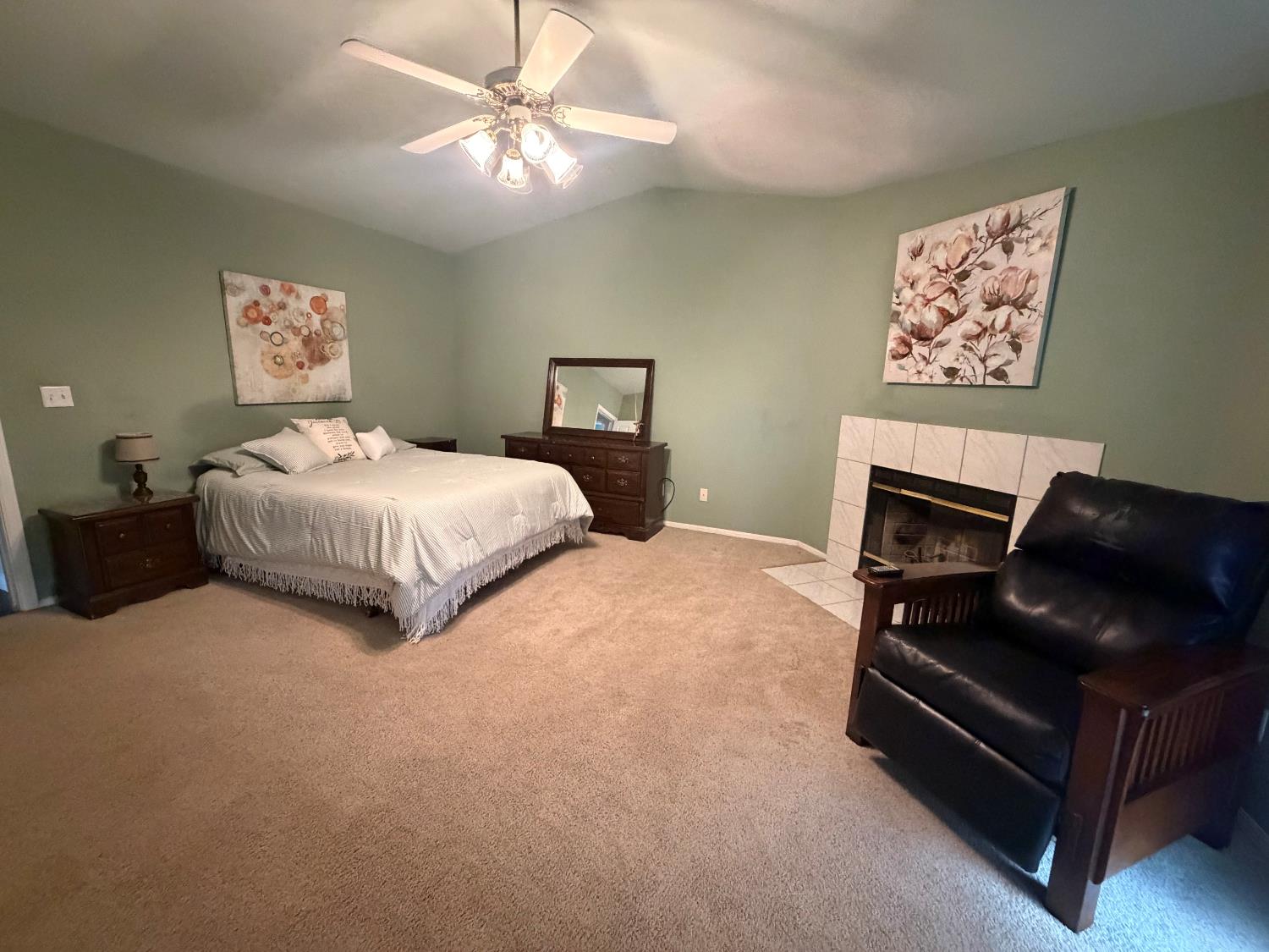16638 Mark Road Madera, CA 93636 - Photo 16 of 22 a bedroom with a bed couch and a window