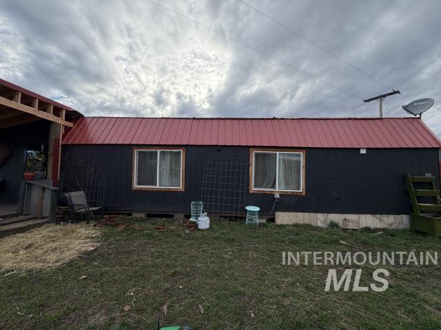155 Mule Deer Kamiah, ID 83536 - Photo 2 of 25 View of side of property featuring a lawn and a metal roof