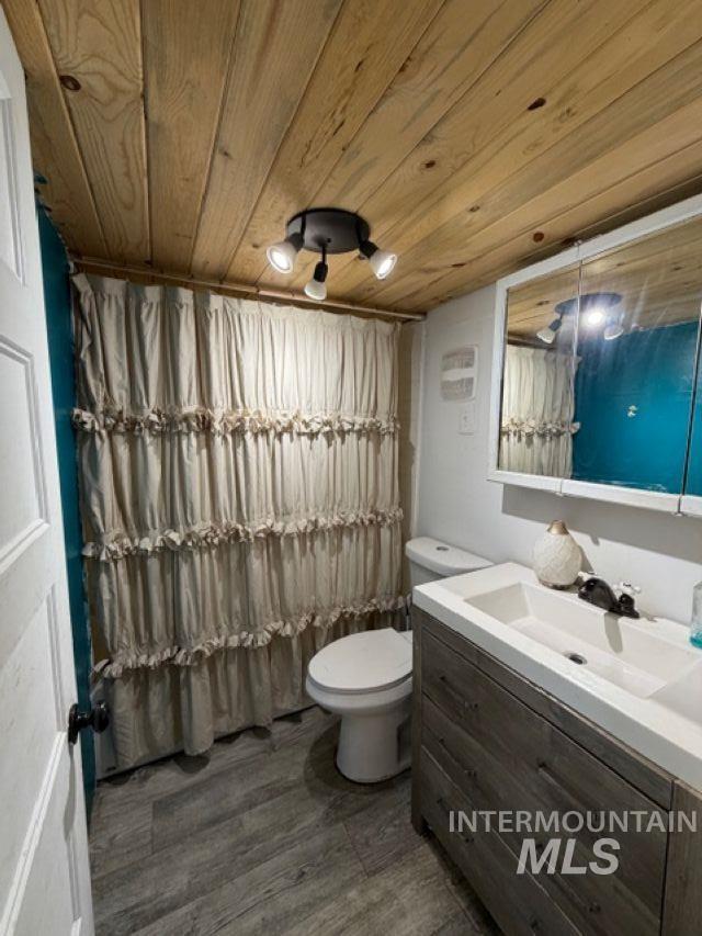 155 Mule Deer Kamiah, ID 83536 - Photo 9 of 25 Full bath featuring vanity, a shower with shower curtain, and wood ceiling