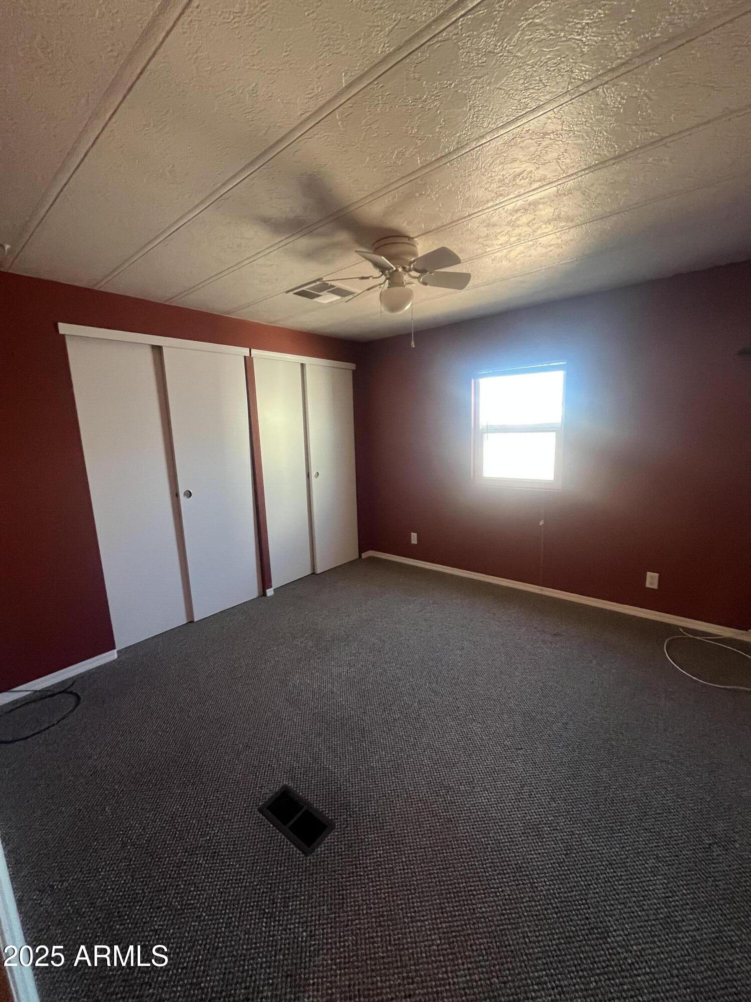 2481 West Broadway Avenue, Unit 31 Apache Junction, AZ 85120 - Photo 12 of 12 an empty room with windows