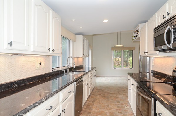 272 Conant Road Weston, MA 02493 - Photo 2 of 16 a large kitchen with stainless steel appliances granite countertop a stove a sink and a granite counter tops