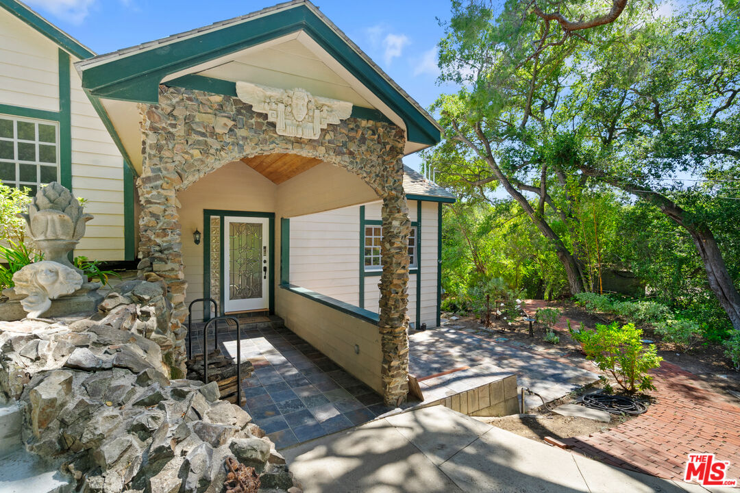 20912 Fontaine Road Topanga, CA 90290 - Photo 2 of 52 a front view of a house with a yard