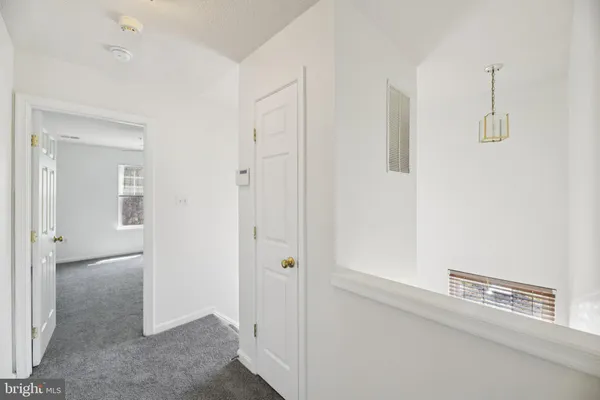 a view of a hallway with closet area