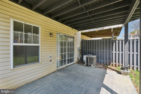 a view of a backyard with chair and tables