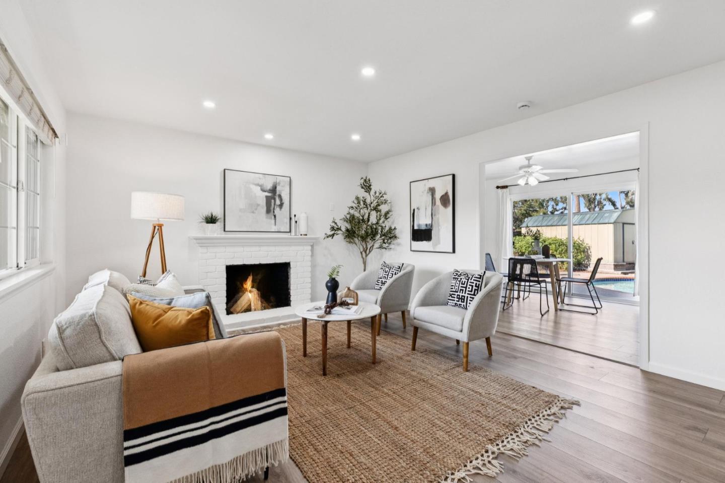 7527 Sutton Lane Dublin, CA 94568 - Photo 12 of 45 a living room with furniture and a fireplace