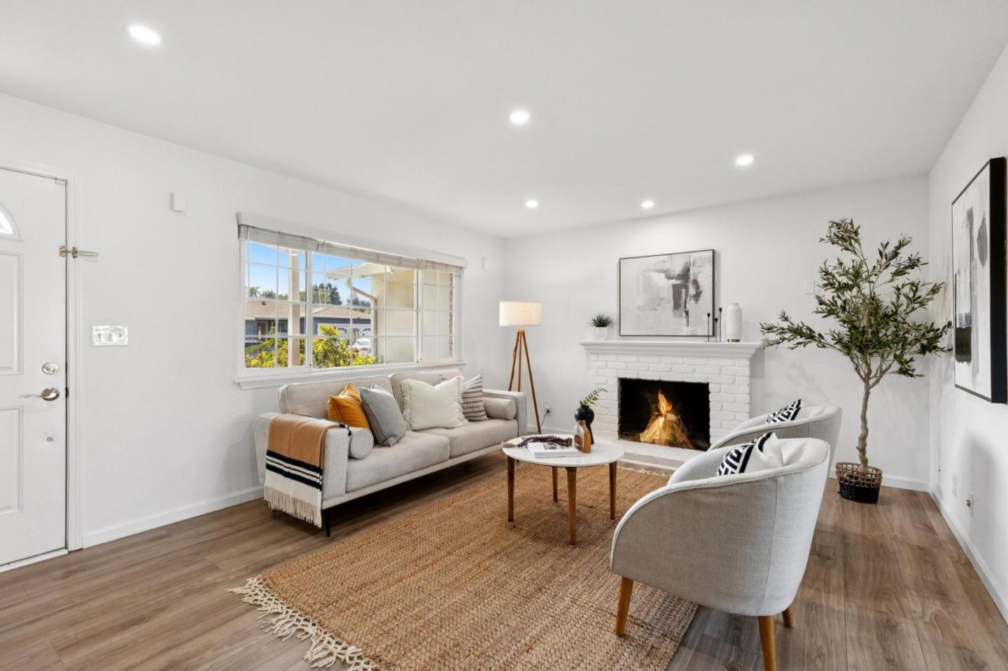 7527 Sutton Lane Dublin, CA 94568 - Photo 14 of 45 a living room with furniture a fireplace and a potted plant