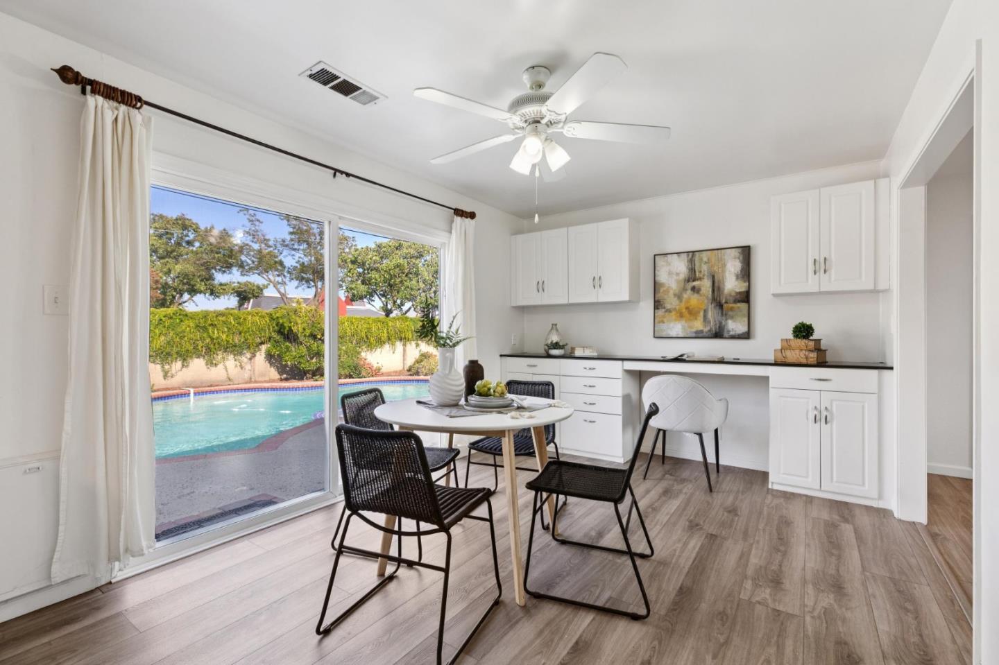 7527 Sutton Lane Dublin, CA 94568 - Photo 18 of 45 a view of a dining room with furniture window and wooden floor