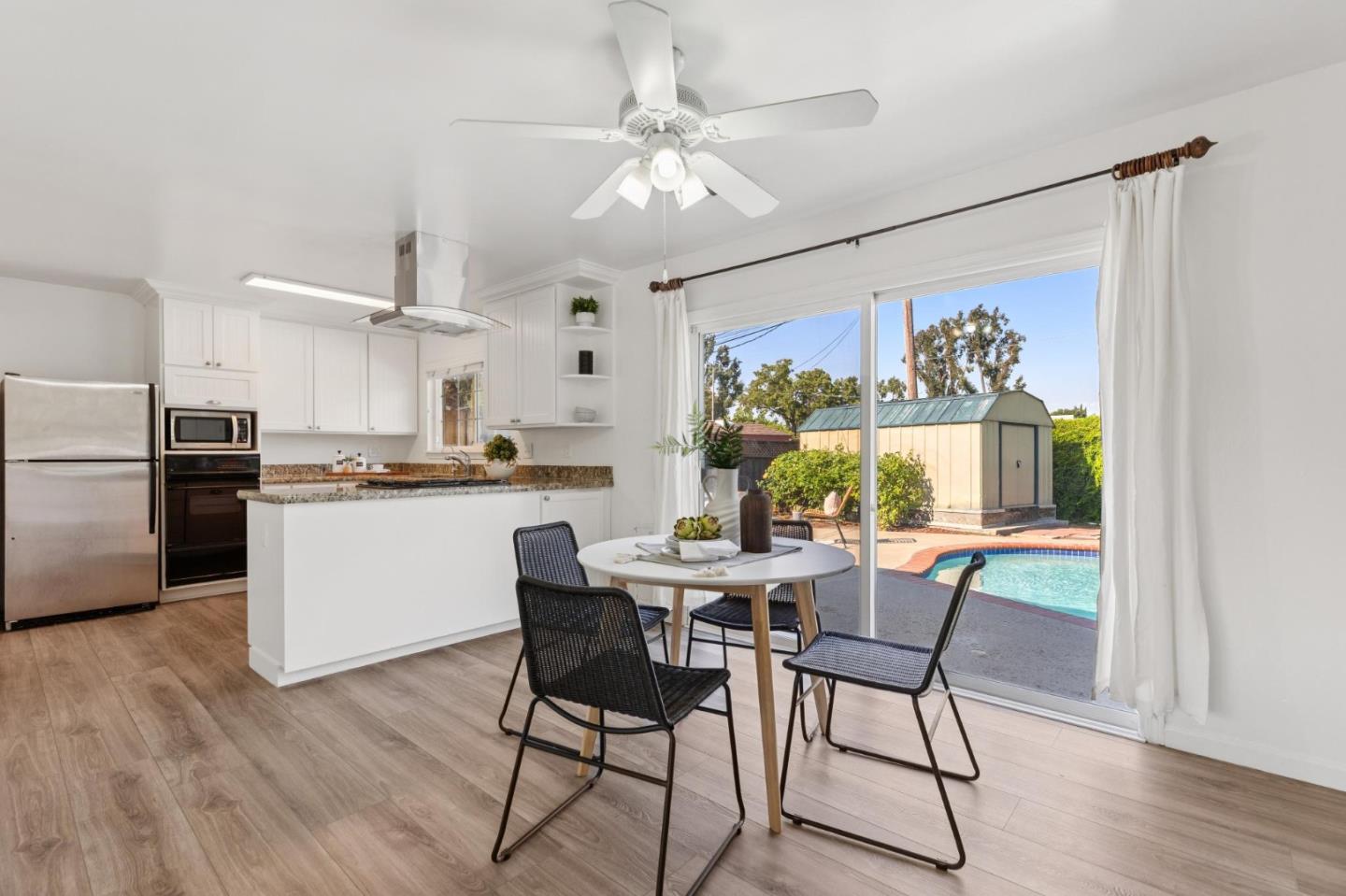 7527 Sutton Lane Dublin, CA 94568 - Photo 19 of 45 a view of a dining room with furniture window and wooden floor