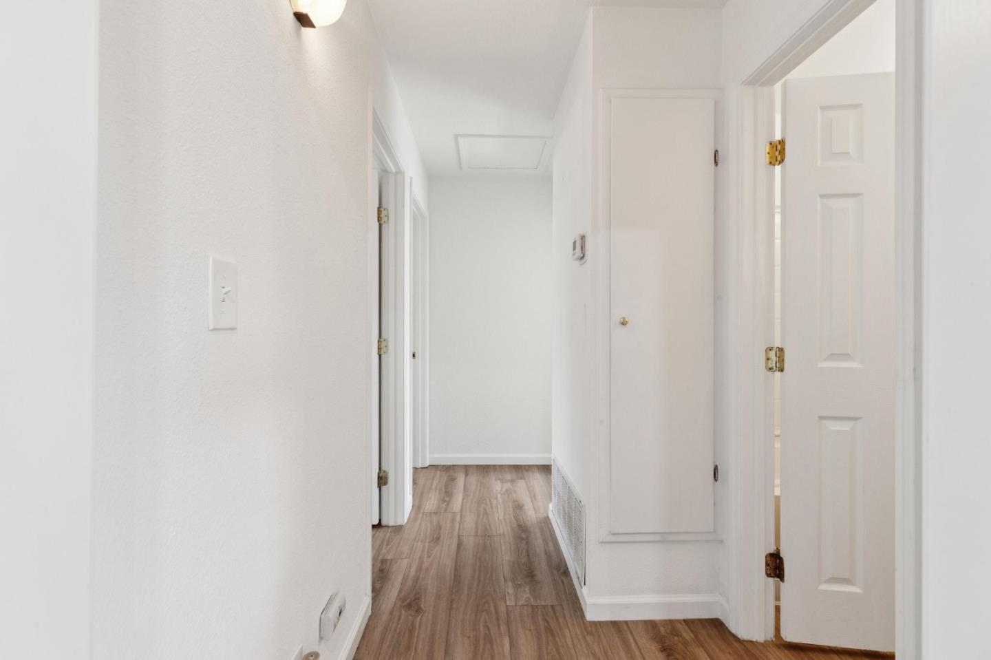 7527 Sutton Lane Dublin, CA 94568 - Photo 21 of 45 a view of a hallway with wooden floor