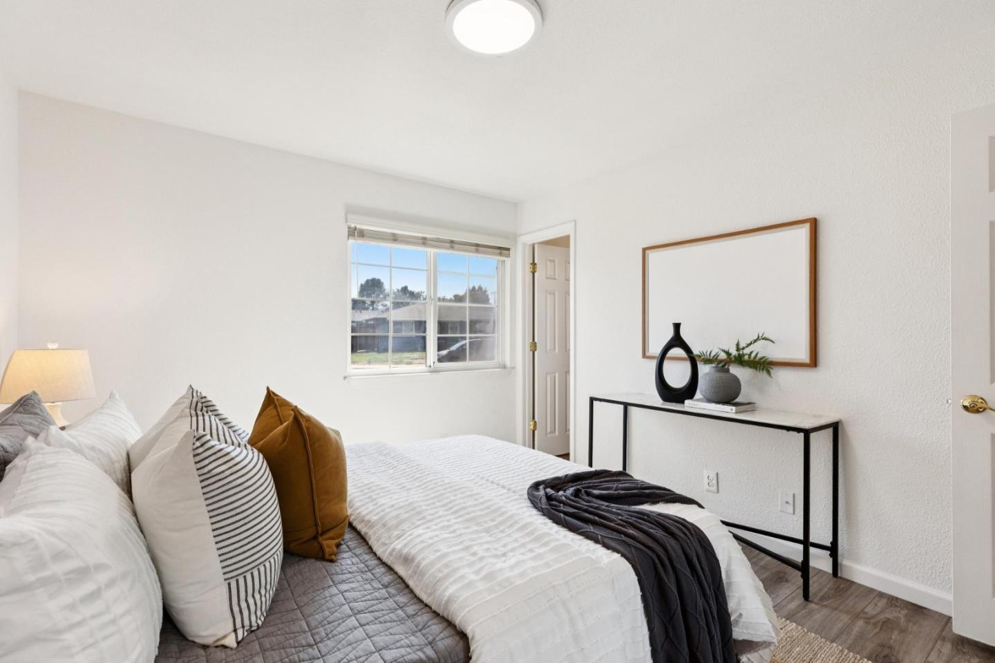 7527 Sutton Lane Dublin, CA 94568 - Photo 23 of 45 a bedroom with a bed and a painting on the wall