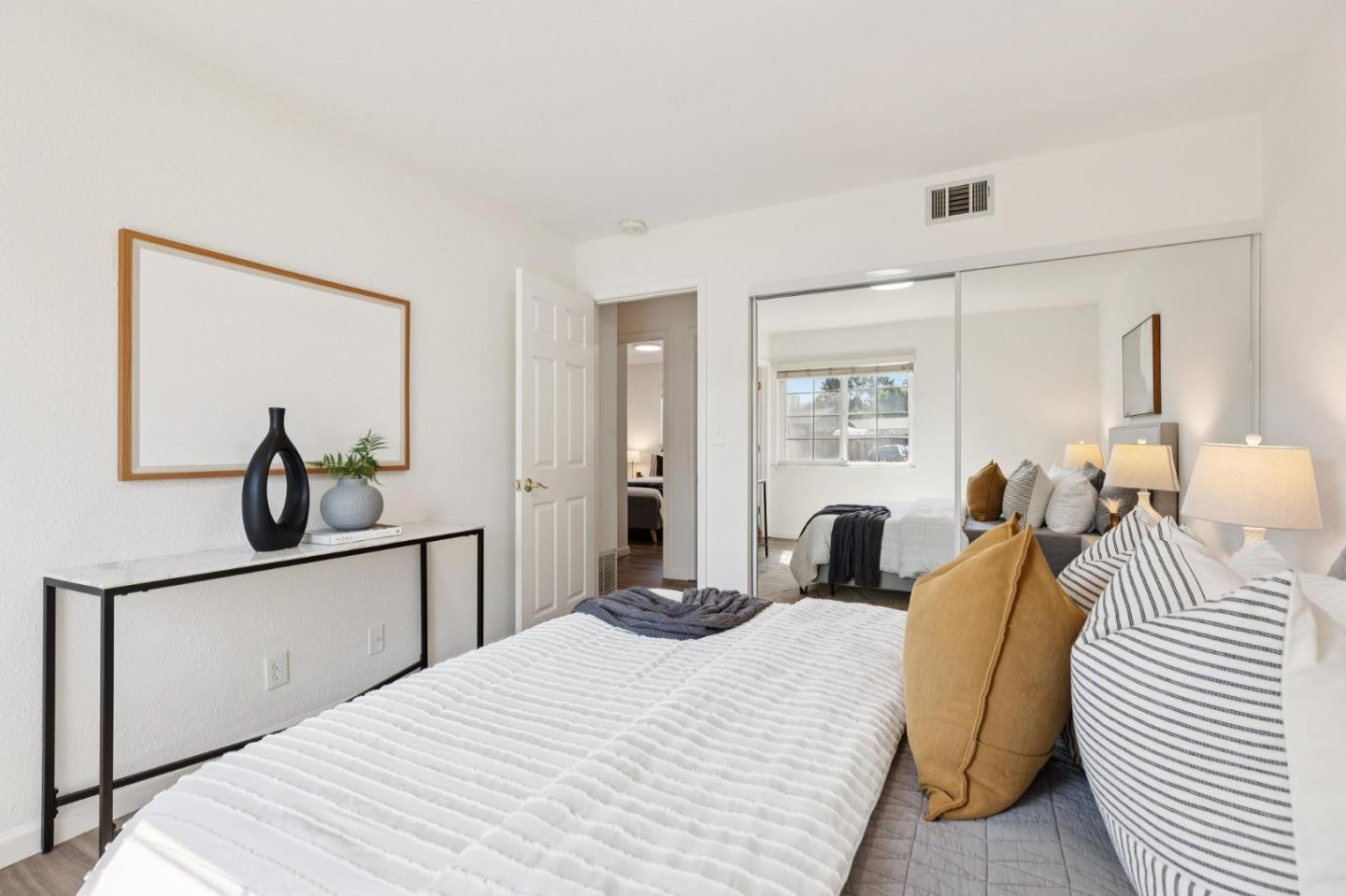 7527 Sutton Lane Dublin, CA 94568 - Photo 24 of 45 a bedroom with a bed and wooden floor