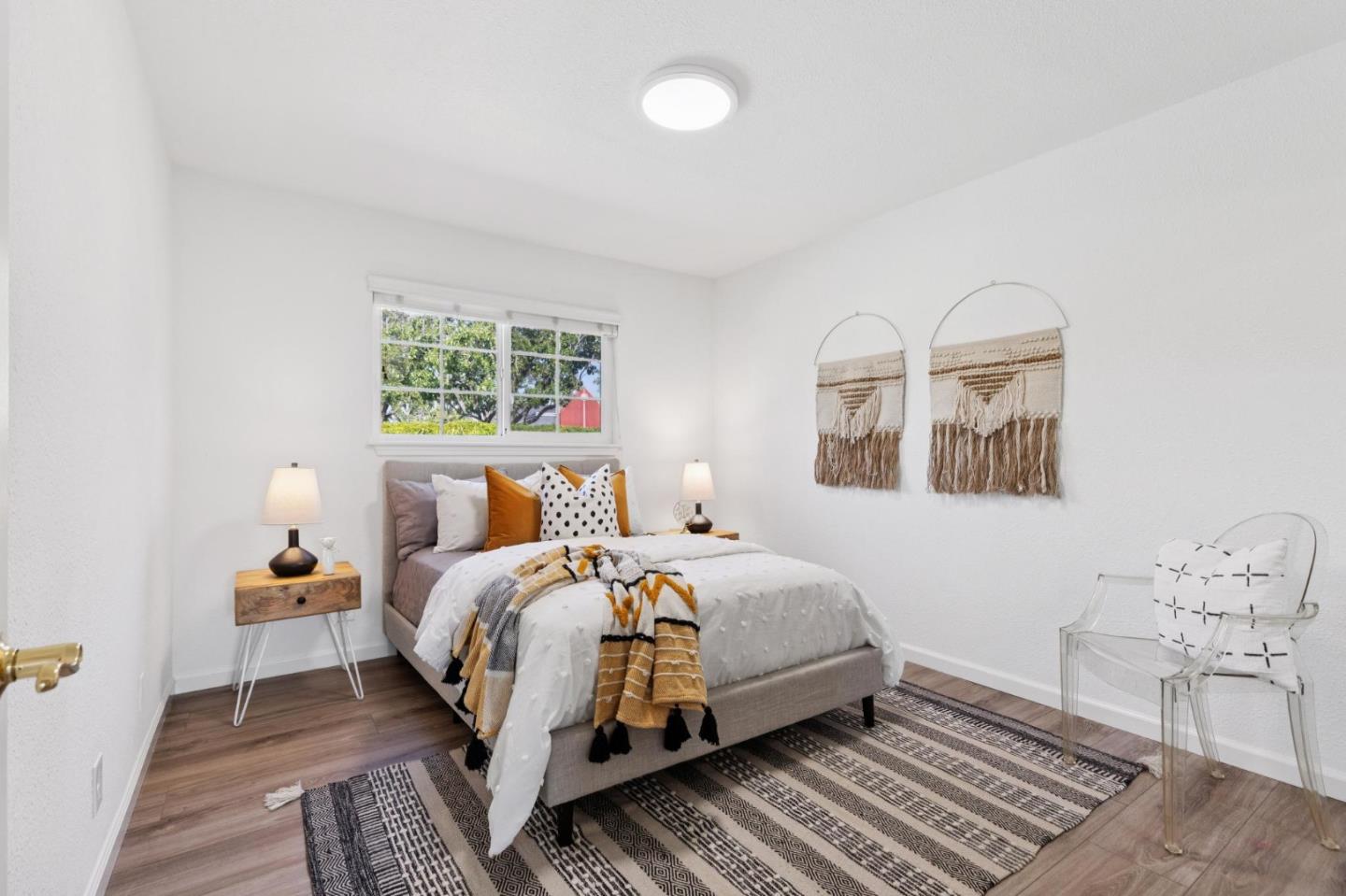 7527 Sutton Lane Dublin, CA 94568 - Photo 28 of 45 a bedroom with a bed wooden floor and window