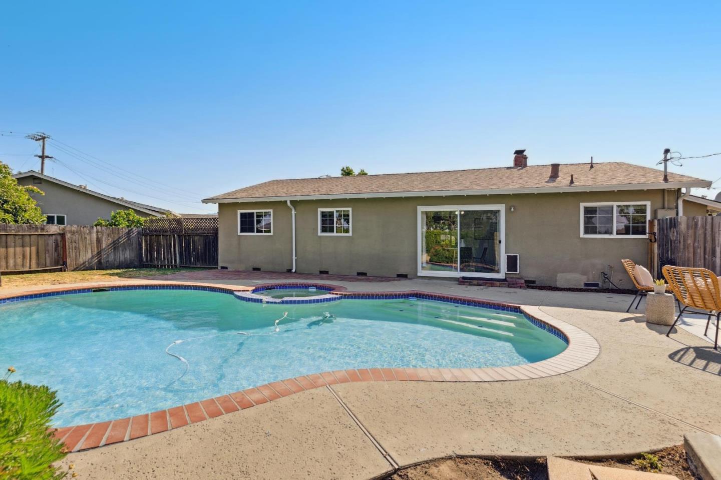 7527 Sutton Lane Dublin, CA 94568 - Photo 35 of 45 a view of a house with backyard sitting area and swimming pool