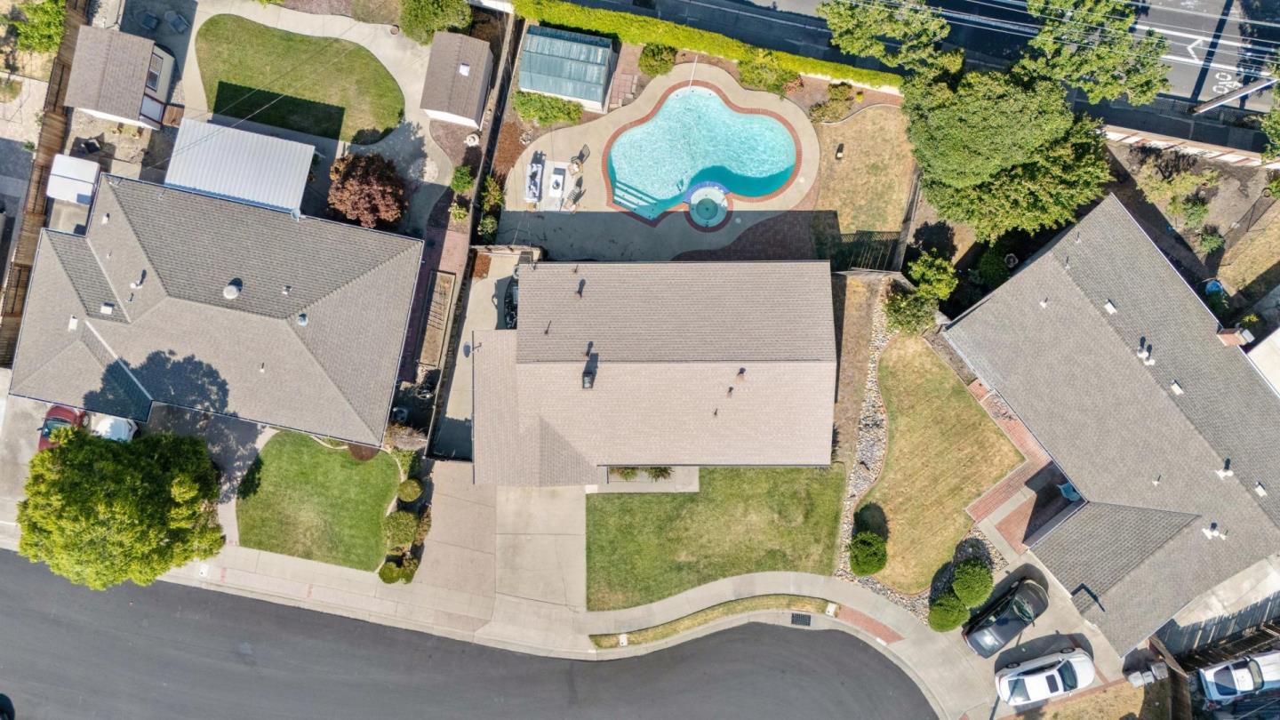 7527 Sutton Lane Dublin, CA 94568 - Photo 7 of 45 an aerial view of a house with a garden and parking