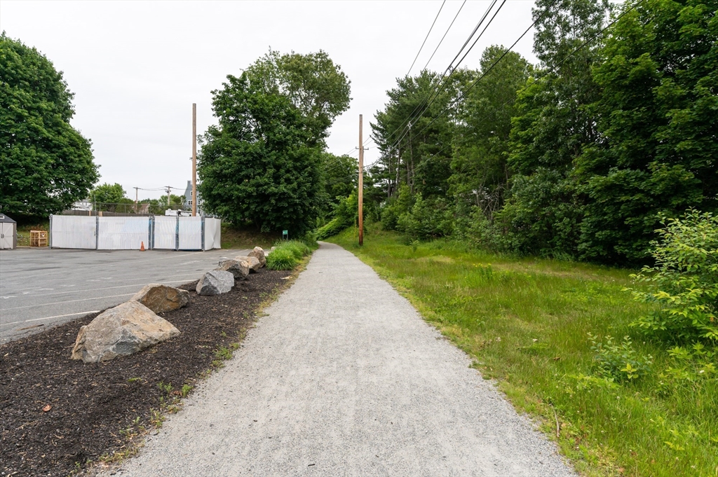 63 Adams Street Danvers, MA 01923 - Photo 15 of 42 a view of a backyard with a garden