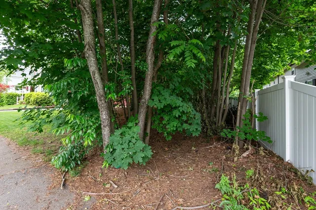 a view of houses with yard