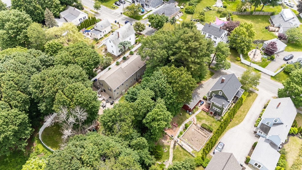 63 Adams Street Danvers, MA 01923 - Photo 42 of 42 an aerial view of residential house with outdoor space and trees all around