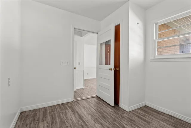 a view of wooden floor in an empty room