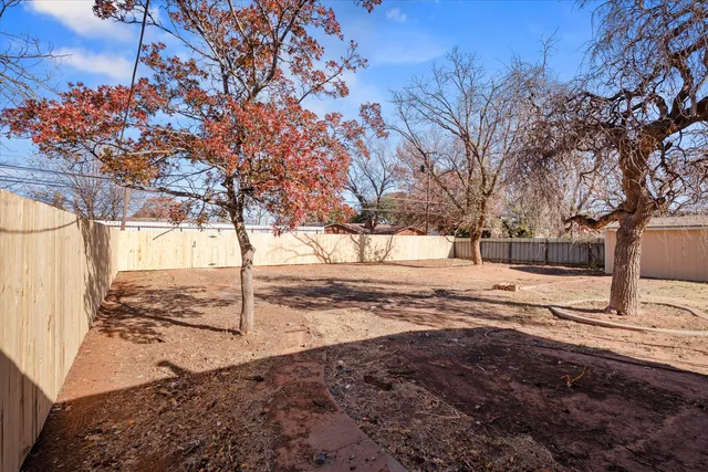 a view of a yard covered with snow