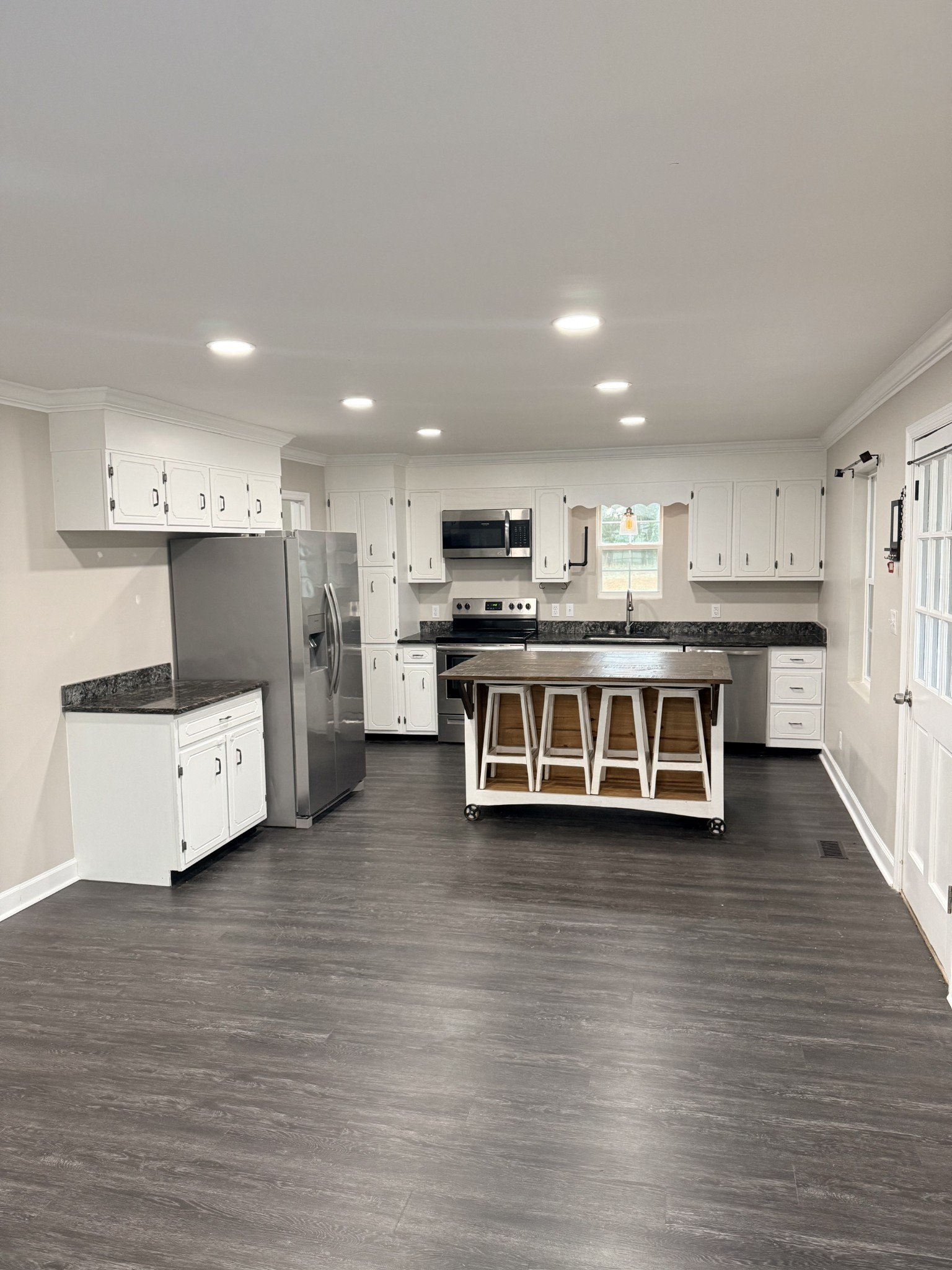 736 Hancock Road Jasper, TN 37347 - Photo 12 of 42 a view of a kitchen with stainless steel appliances granite countertop a stove and a refrigerator