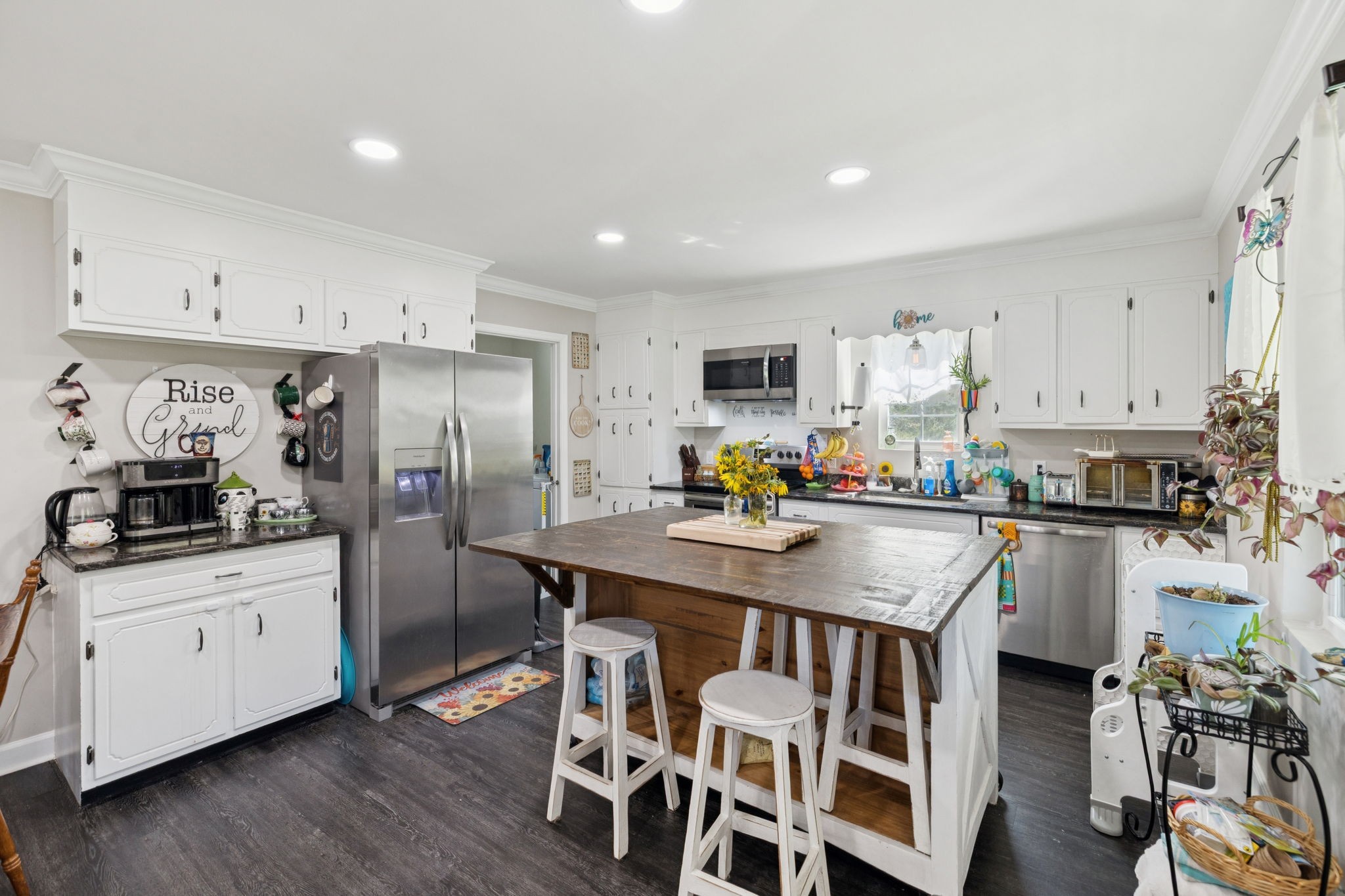 736 Hancock Road Jasper, TN 37347 - Photo 15 of 42 a kitchen with stainless steel appliances a sink a stove a refrigerator cabinets and dining table