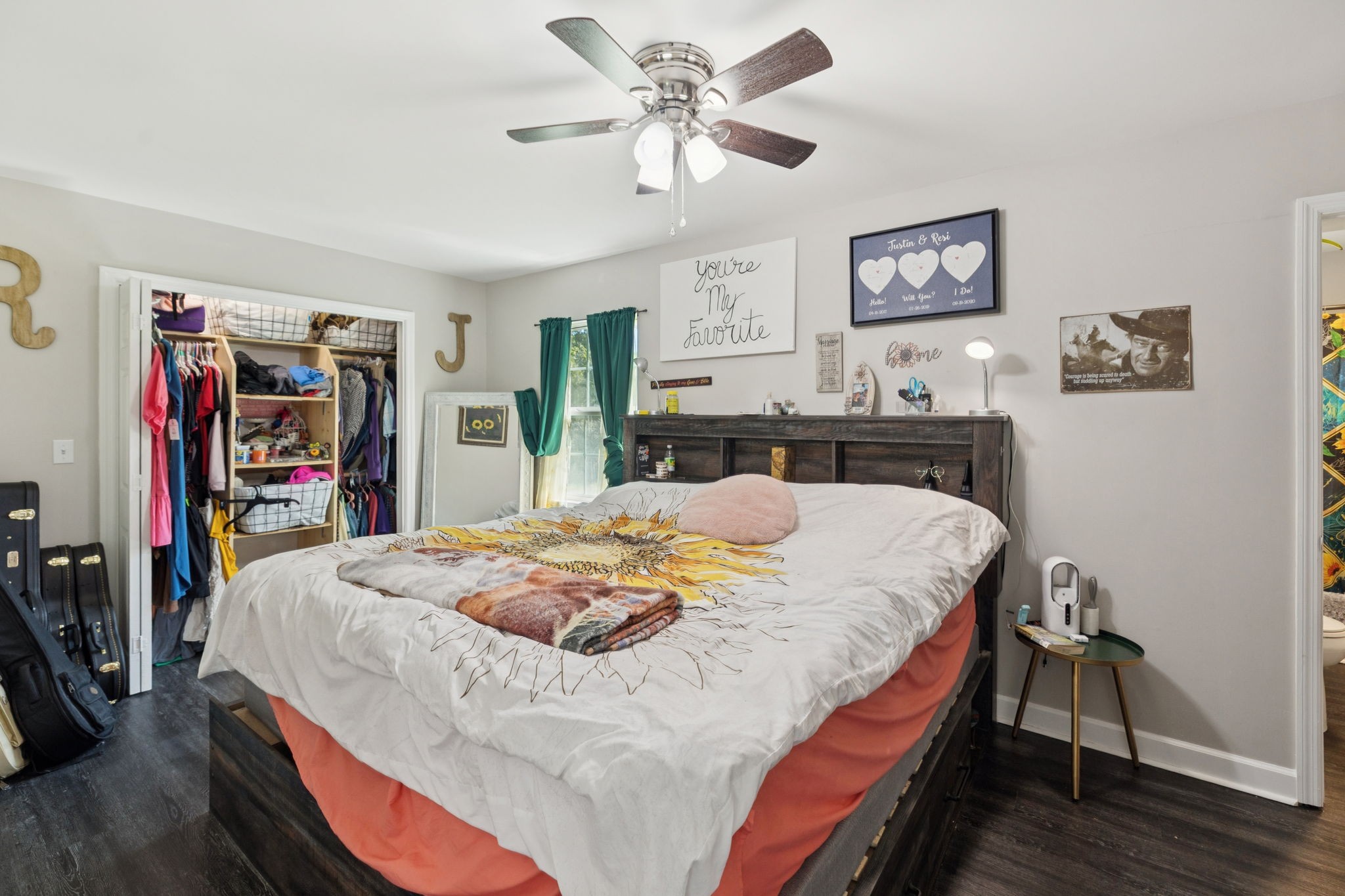 736 Hancock Road Jasper, TN 37347 - Photo 19 of 42 a bed sitting in a bedroom next to a window with a bookshelf