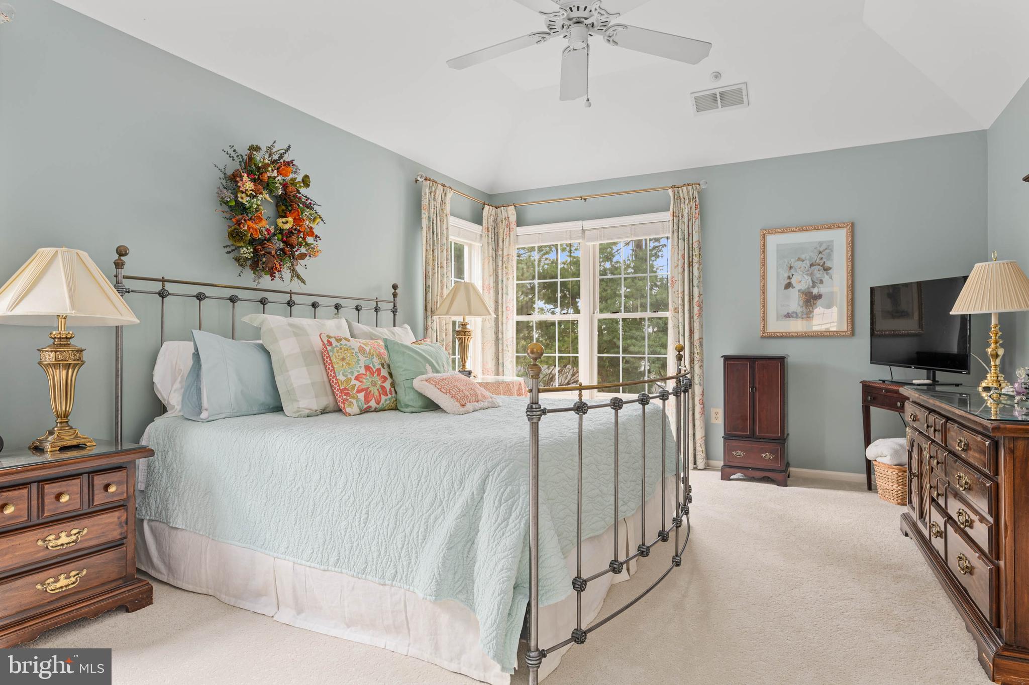 4 Riders Run Newtown Square, PA 19073 - Photo 28 of 64 a bedroom with a bed and a flat tv screen on dresser
