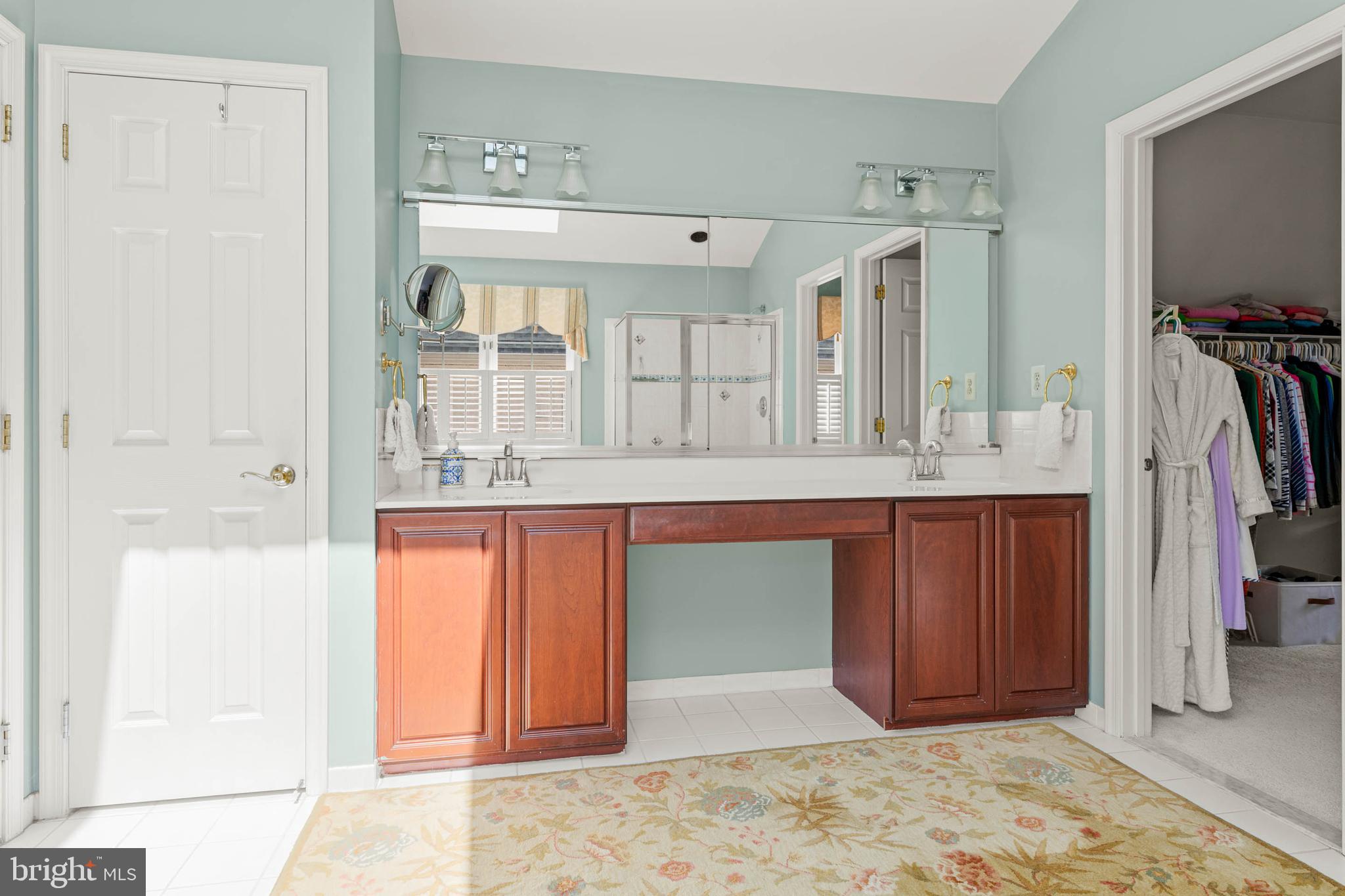 4 Riders Run Newtown Square, PA 19073 - Photo 31 of 64 a bathroom with a granite countertop sink and a mirror