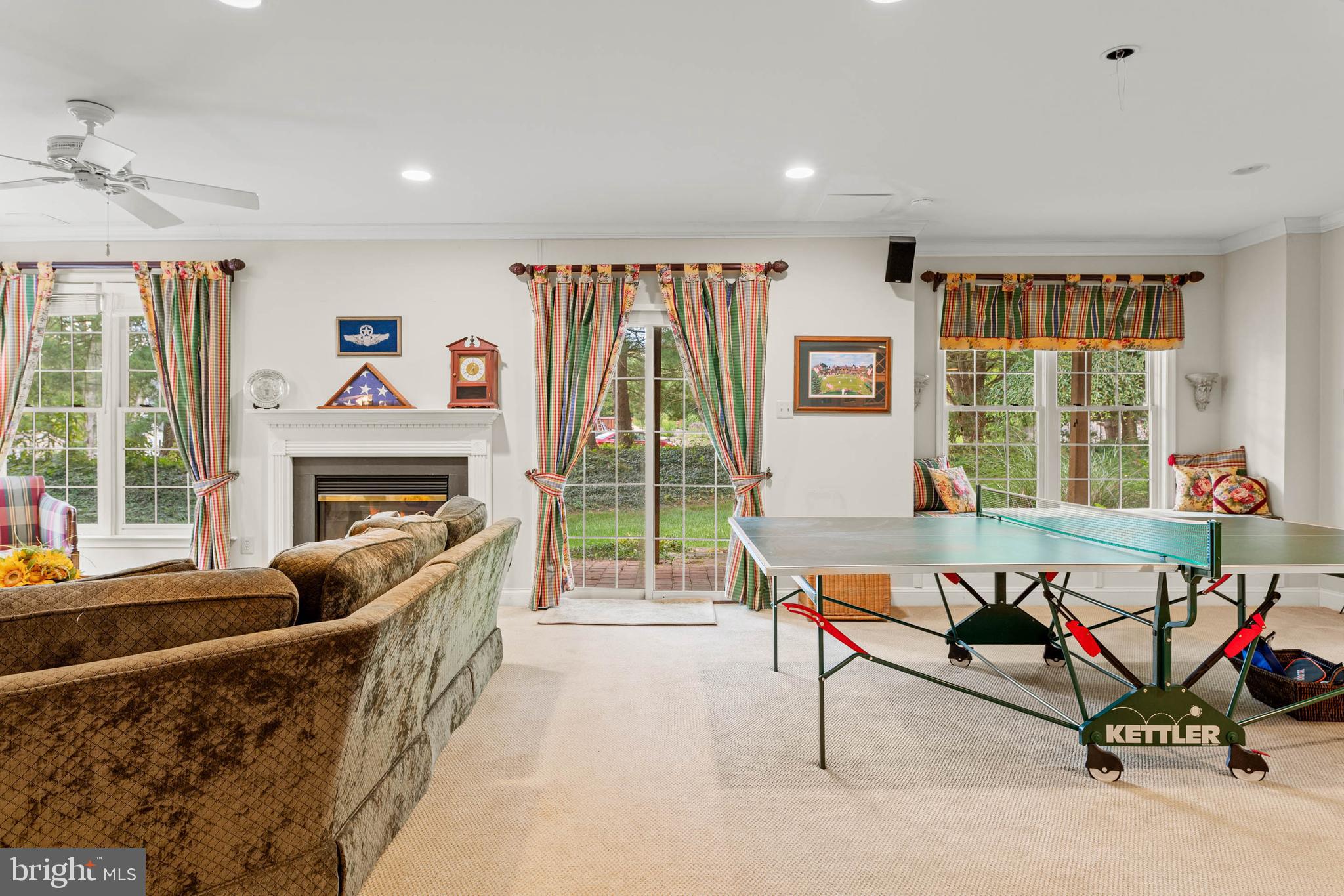 4 Riders Run Newtown Square, PA 19073 - Photo 48 of 64 a living room with furniture a flat screen tv and a floor to ceiling window