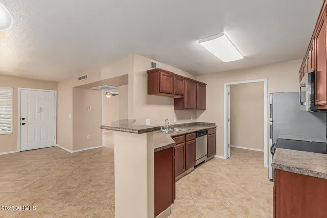 a view of room with window and ceiling fan