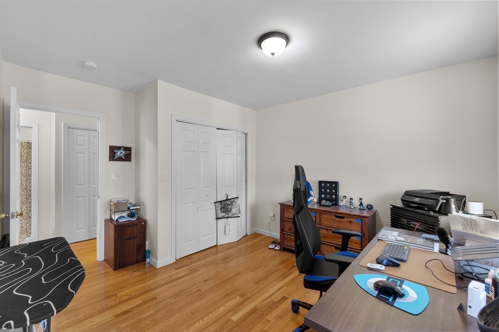 38 Brook Street Georgetown, MA 01833 - Photo 24 of 42 a bedroom with bed and a wooden floor
