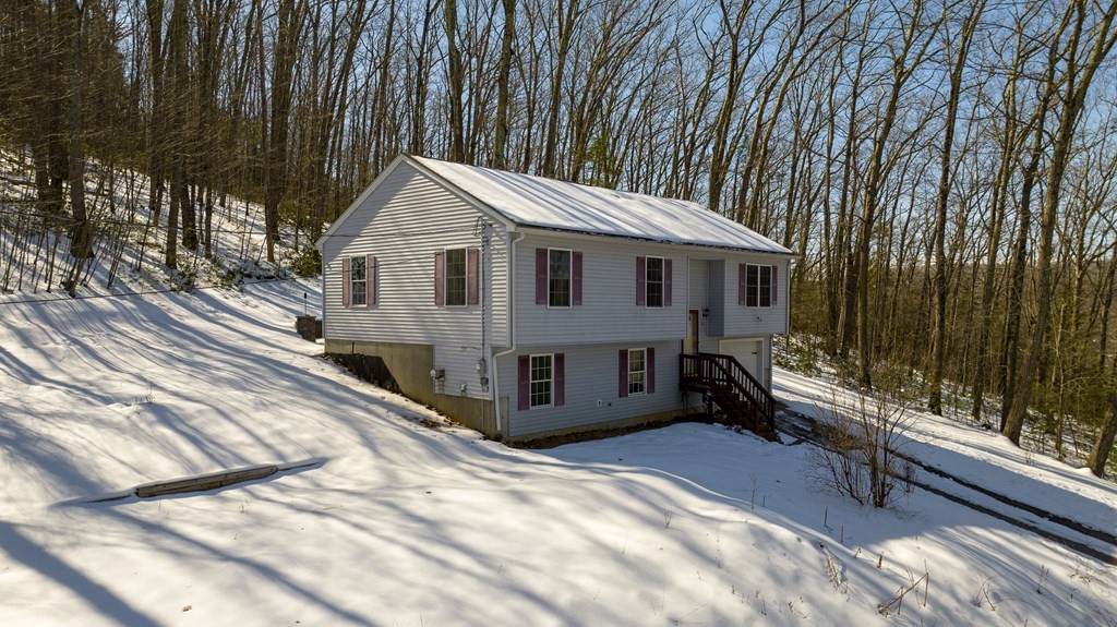 62 Vinton Road Holland, MA 01521 - Photo 3 of 37 a front view of a house with a yard
