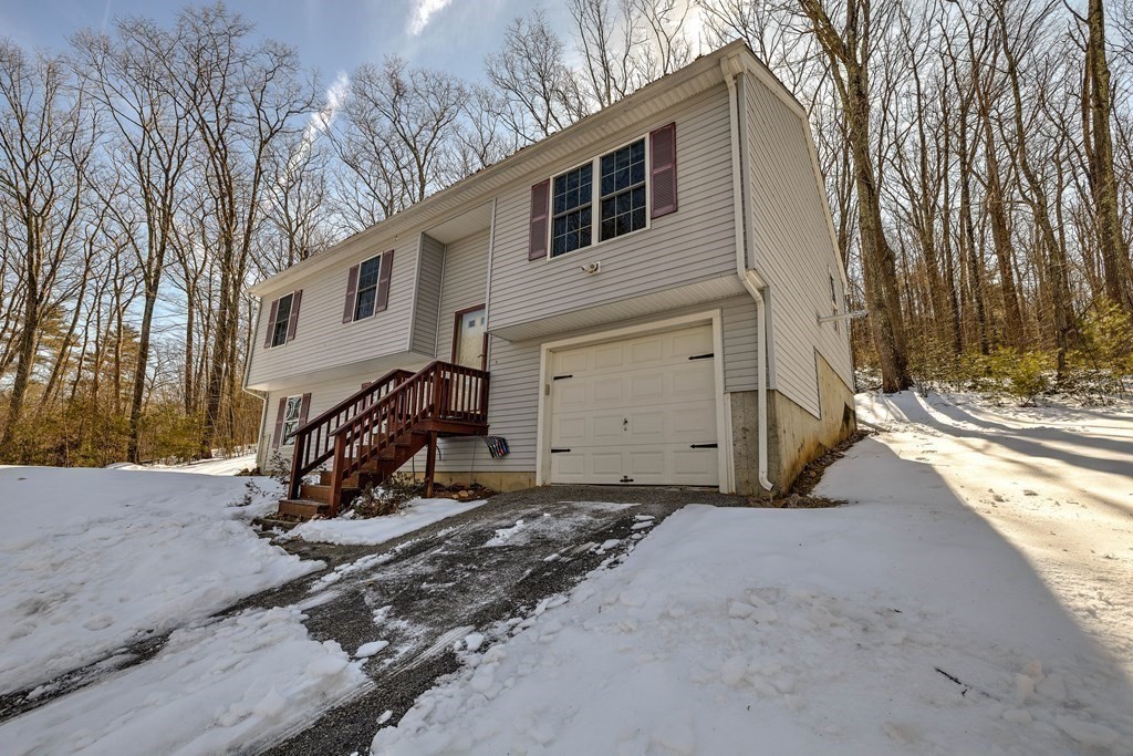 62 Vinton Road Holland, MA 01521 - Photo 35 of 37 a view of a house with a snow in the yard
