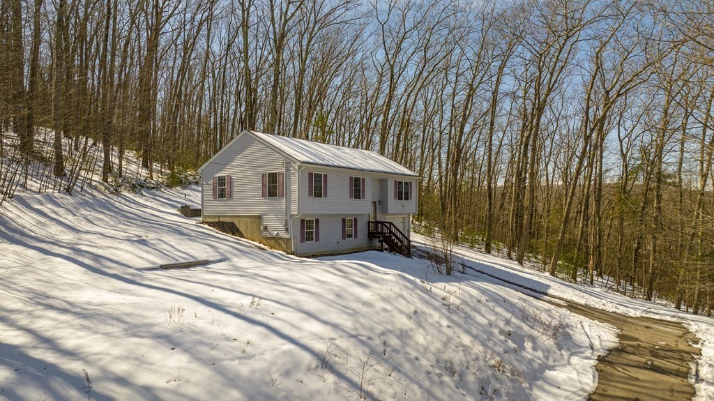 62 Vinton Road Holland, MA 01521 - Photo 5 of 37 a front view of a house with a yard