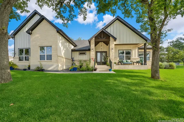 a front view of house with yard and green space