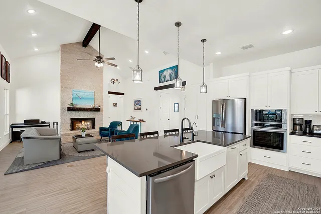 a view of a dining room with furniture large window and wooden floor
