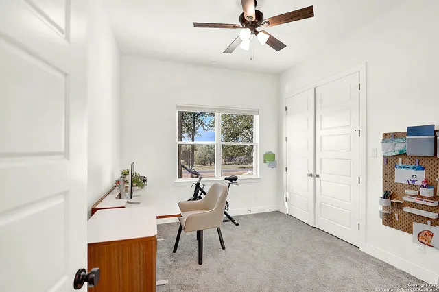 a view of a bathroom with a sink and a mirror